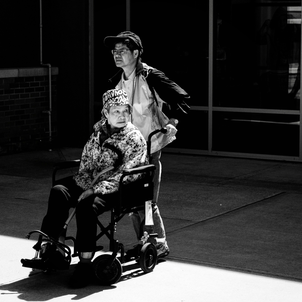 A caregiver supporting an older adult at home